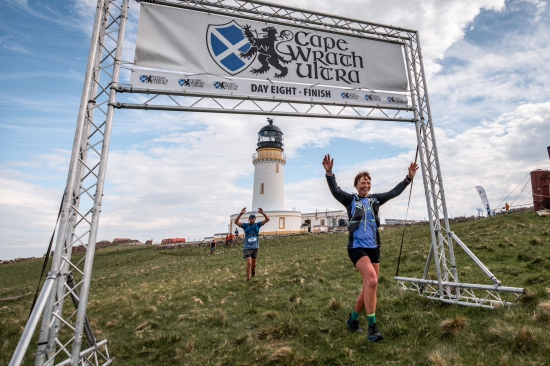 Bridget Glaister crosses the finish line to win Cape Wrath Ultra